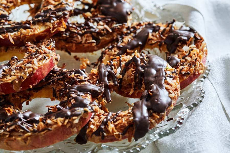 Caramelized coconut, drizzled chocolate and peanut butter top this fun-to-eat, crave-able snack 
	