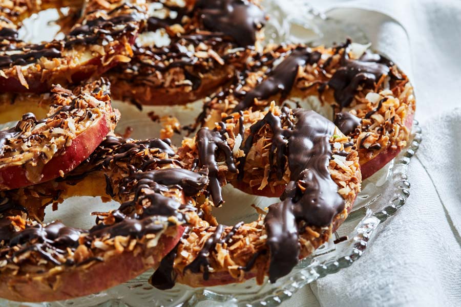 Caramelized coconut, drizzled chocolate and peanut butter top this fun-to-eat, crave-able snack