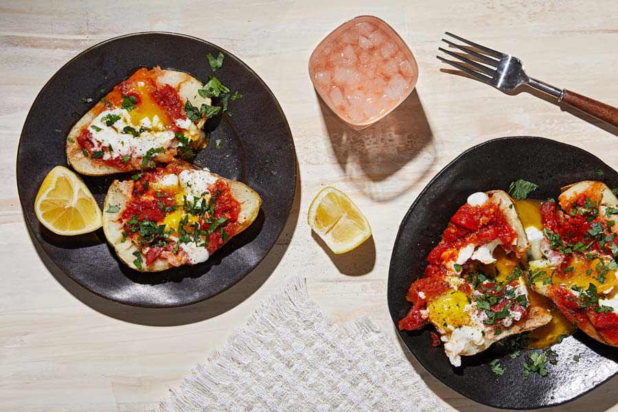 These shakshuka-stuffed spuds are just the right kind of mess
	
