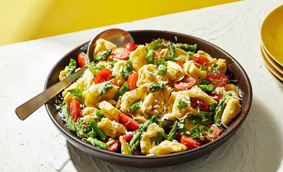 This bright, adventurous salad topped with fresh basil dressing is the perfect side dish -- or even a main -- as the days get warmer, longer 