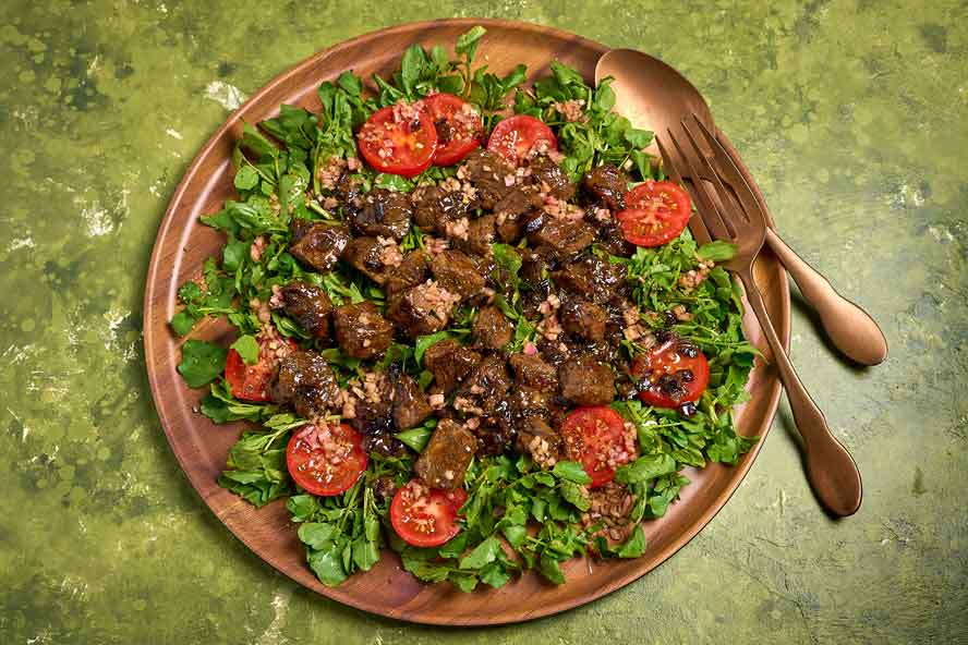 This French-inspired Vietnamese shaking beef features tender cubes of meat in a savory-sweet stir-fry, strays from the typical preparation
