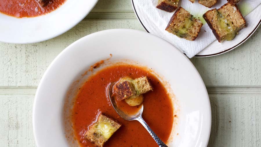  A sophisticated version of a childhood favorite: This delicious but decidedly non-creamy tomato soup has buttery, cheesy bites of grilled cheese sandwich floating atop
	
	