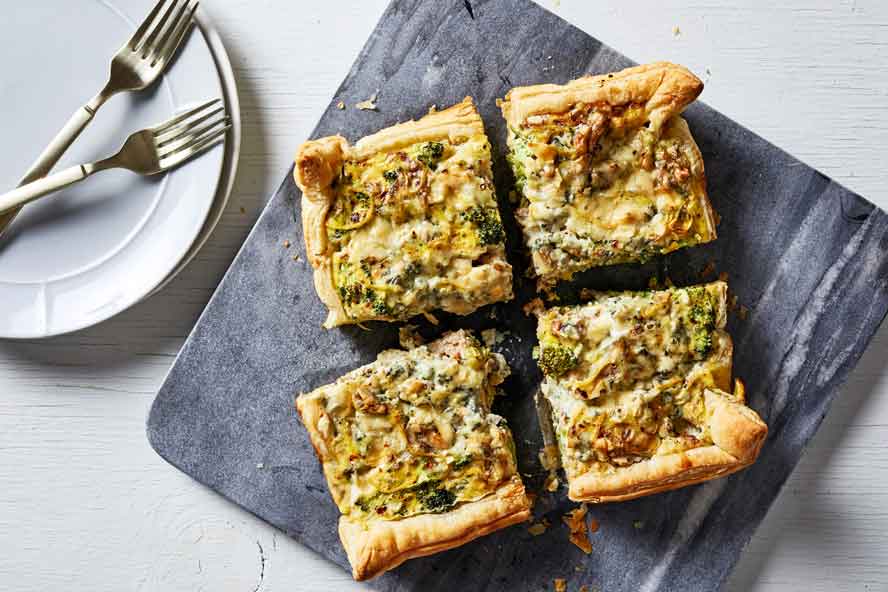 Golden puff pastry turns a quick quiche into a weeknight showpiece
	