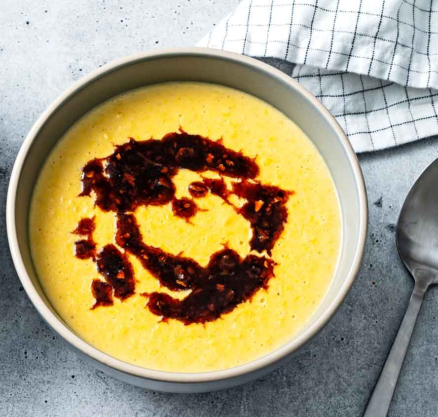 Summer soup?  Coconut  corn soup with chili crisp is a sweet and spicy bowl of comfort
