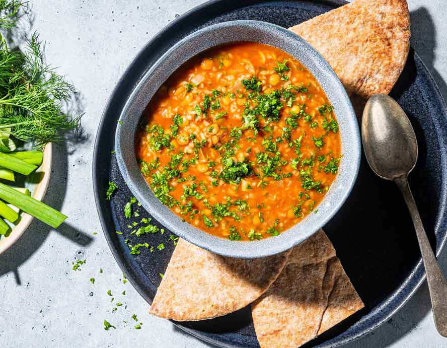Hearty tomato-lentil soup is warm, tangy and filled with Persian flavors
	
	