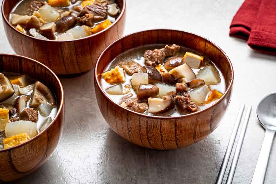 This Korean beef and daikon soup with mushrooms features a clean, flavorful broth
	