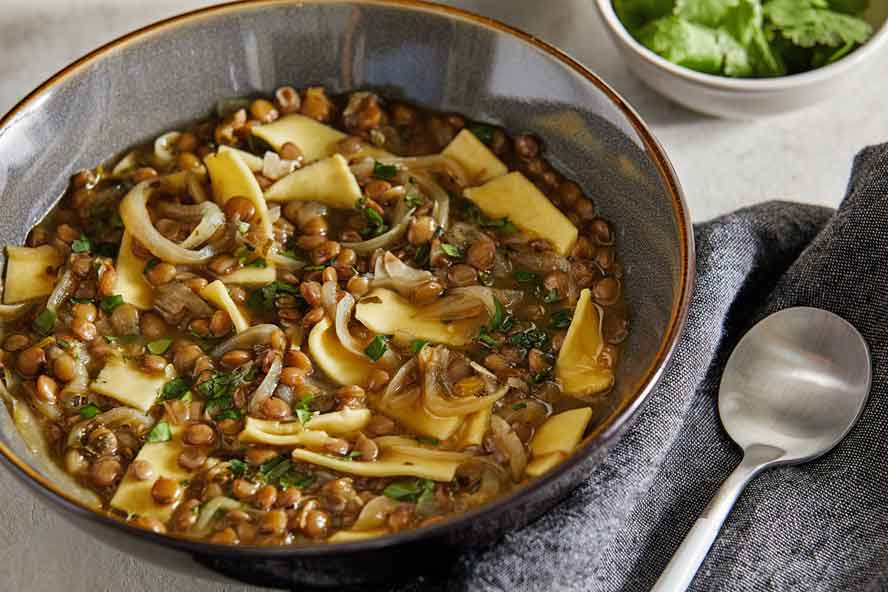 A Midle Eastern lentil and pasta soup -- with amazing flavor and texture -- that serves as a respite in this hectic season