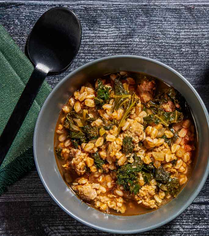 This comforting stew features savory sausage, nutty farro and fresh kale --- and is the easiest one-pot meal I know

