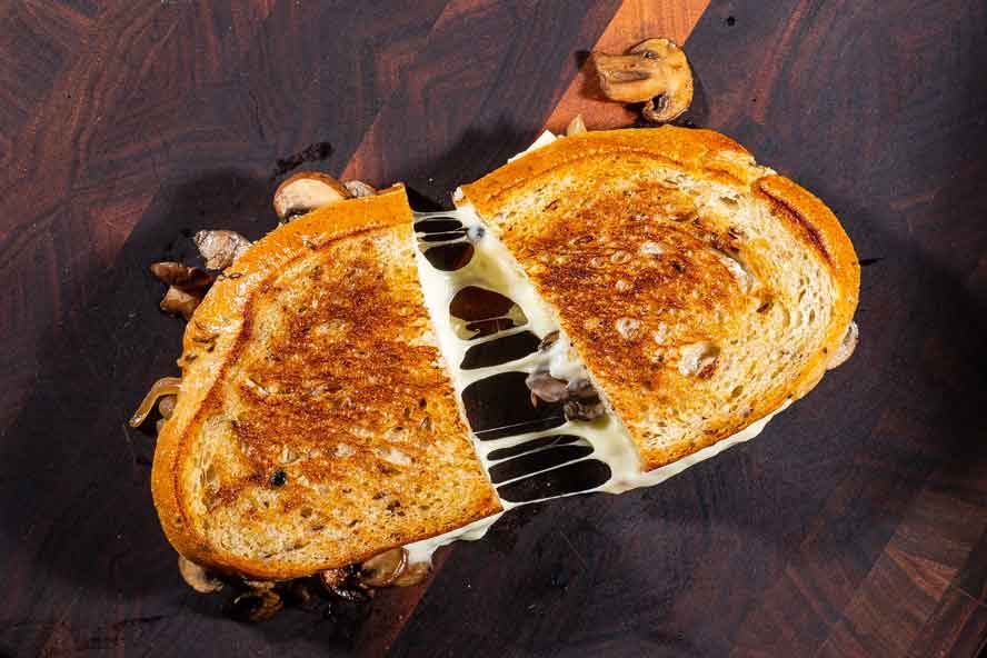 This diner-style 'patty' melt is full of caramelized onions, mushrooms and cheese
	
