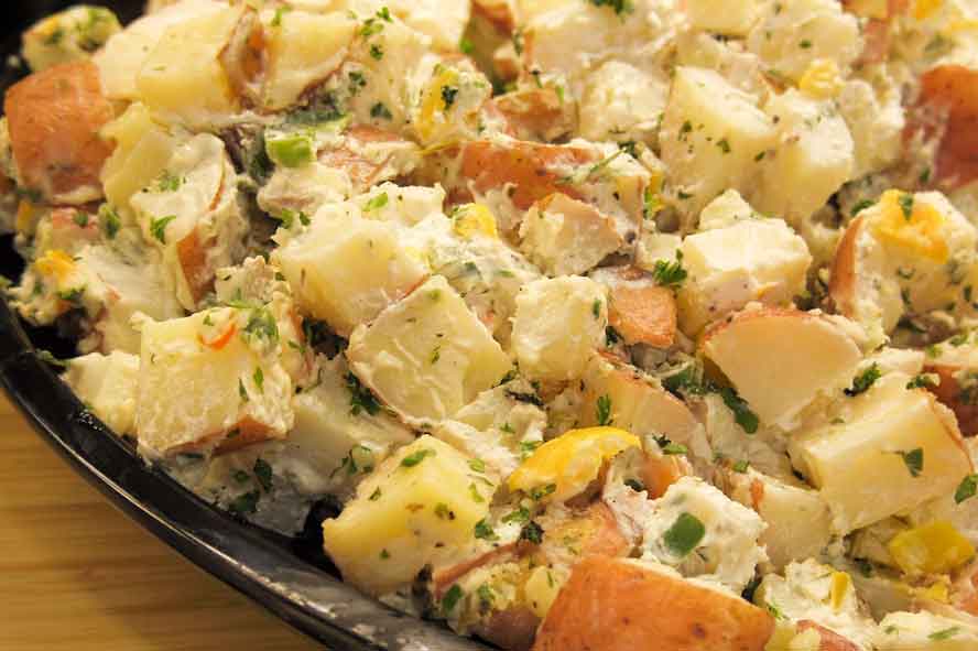 This zesty, no-dairy Mediterranean-California potato salad offers a jolt of deliciousness for your weekend barbecue