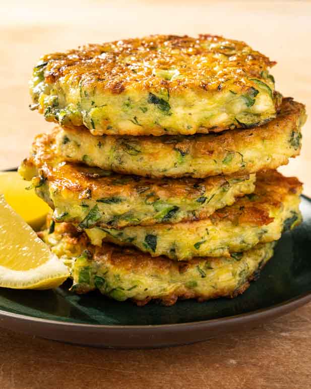 These fluffy pancakes are packed with shredded zucchini, herbs and salty bites of feta cheese --- and taste like summer
	
	